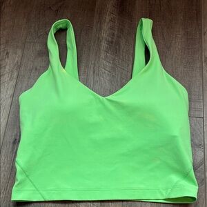 Lululemon tank top with built in bra lime green has a couple of faded spots.